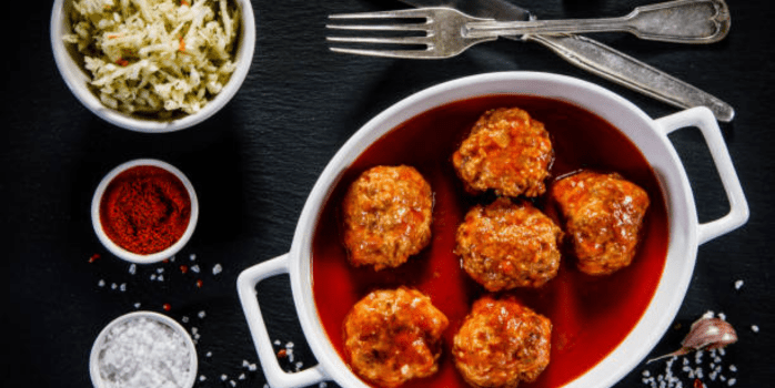 "An array of chicken meatballs representing various cuisines, showcasing their cultural significance and versatility in dishes like Italian polpette, Middle Eastern kofta, Asian dumplings, and more."