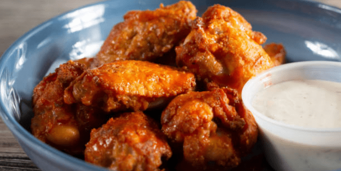 The Essence of Louisiana Fried Chicken: A plate of crispy, golden fried chicken seasoned with Cajun spices, embodying the flavors of Louisiana. 