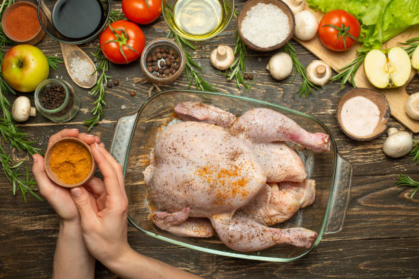 A flavorful dish featuring tender chicken back pieces cooked to golden perfection, garnished with fresh herbs, and served alongside a side of vibrant vegetables on a rustic wooden plate.